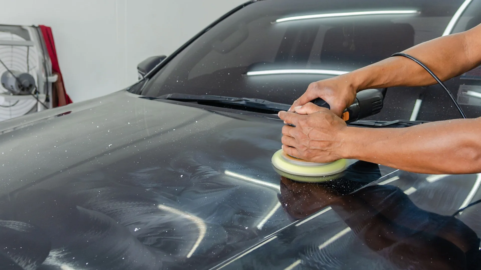 Car being detailed by hand